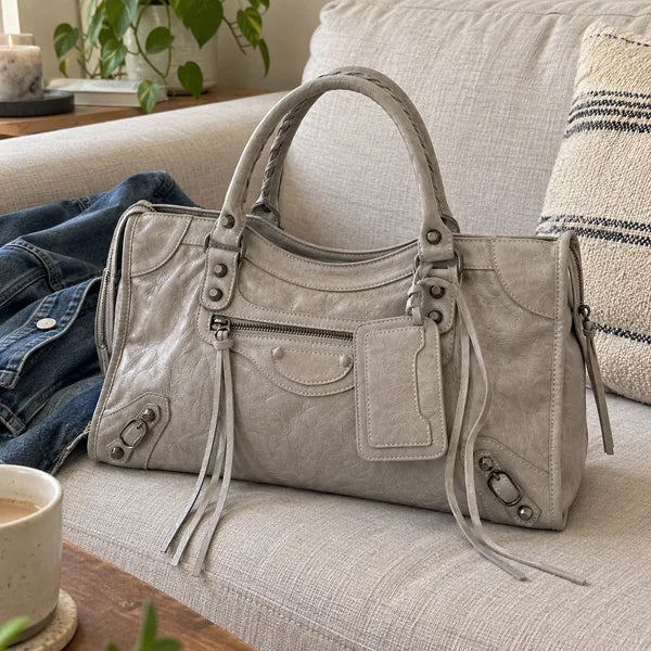 AI-generated image: bag It Girl medium, light grey, in an everyday setting